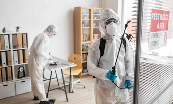 Pest control technicians disinfecting office – PC Los Angeles