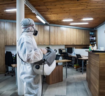 Pest control specialist disinfecting commercial office space – PC Los Angeles