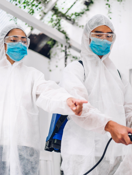 Pest control team in protective suits at work – PC Los Angeles
